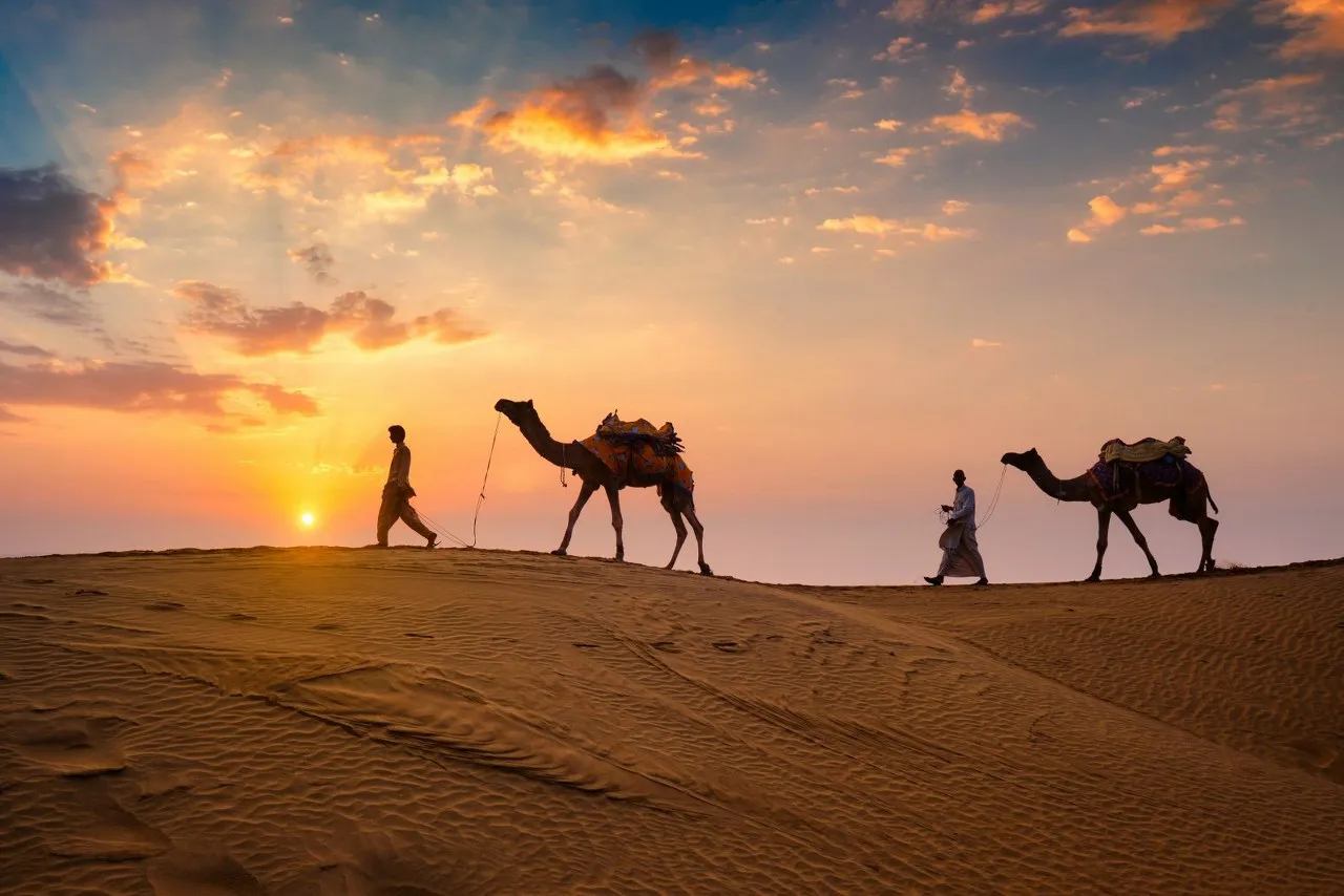 Family camel safari near Jaisalmer desert camp